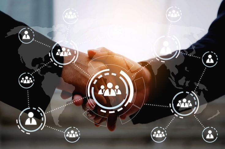 Handshake overlaid with network connection icons